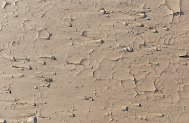 Cracks in the clay as a background top view