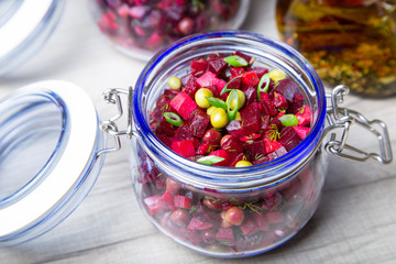 Vinaigrette salad with olive (vegetable) oil in a jar. Selective focus, close-up.
