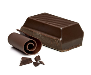 Chocolate curls and chocolate bars, chips or pieces isolated on white background