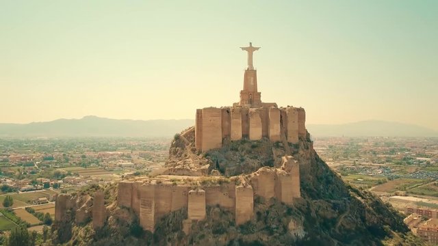 Aerial view of statue of Christ and Castillo de Monteagudo, Spain