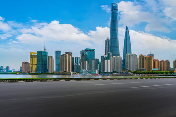 Obraz premium Empty asphalt road along modern commercial buildings in China's cities