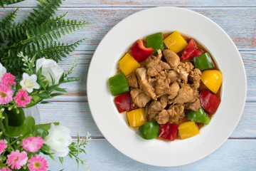 Fried sweet pepper or bell pepper with pork put on white ceramic plate