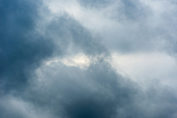 Fototapeta na wymiar Background with blue dense clouds