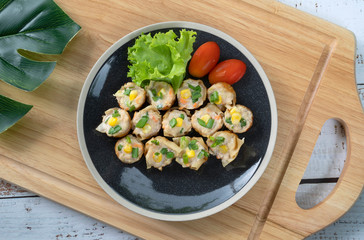 Gyoza filled with lean pork mince or chicken, finely shredded cabbage, carrot, ginger, sesame oil, soy bean, sugar, grilled on Takoyaki pan.