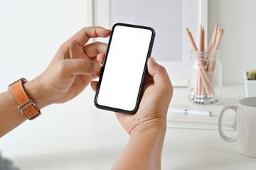 Businessman's hand using blank white screen mobile smart phone.