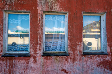 Fototapeta na wymiar old window in vintage look with mirrored houses