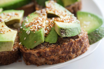 Sandwiches with avocado and grain bread, close view