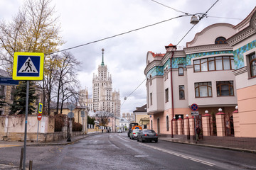 Moscow cityscape with old and modern architecture. View of Goncharnaya street and skyscraper on Kotelnicheskaya Embankment.