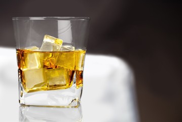 Glass of tasty cocktail  on   background