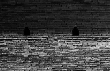 Wall brick gray is divided into light and shadow parts. Bricks wall background with vignette corners. for interior or design.