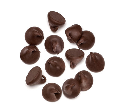 Scattered chocolate chips morsels or drops from top view isolated on white background