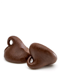 Chocolate drops or chocolate chips morsels close up view isolated on white background