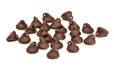 Scattered chocolate chips morsels or drops pile from top view isolated on white background