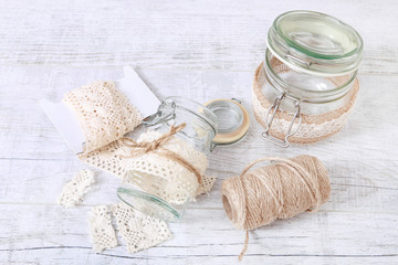 Fototapeta na wymiar How to make glass jar decorated with lace and string