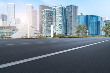 Fototapeta premium Urban road asphalt pavement and skyline of Hangzhou urban construction