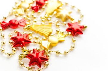 Christmas decoration isolated on white. Red and golden stars, candies, christmas trees.