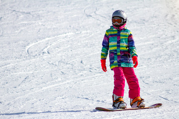 Girl snowboarder on ski track. Free space for text