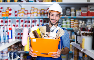 foreman holding basket with tools