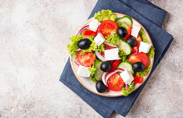 Traditional Greek salad with feta, olives and vegetables
