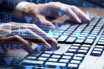 Man's hands typing on keyboard. close up