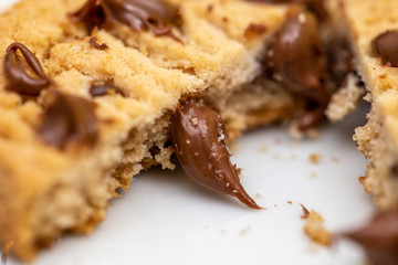 Creamy chocolate filling cookies. Drops of creamy chocolate on homemade biscuit.