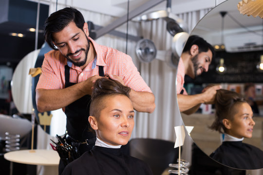 hairdresser working with woman hair