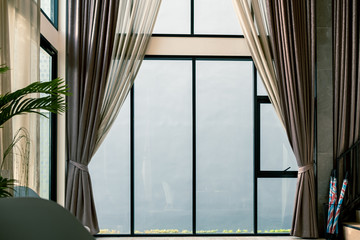 curtain in loving room, interior design and decoration at home with light and glass window behind