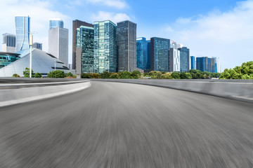 Fototapeta premium Urban road asphalt pavement and skyline of Hangzhou urban construction
