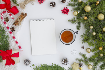 Fototapeta na wymiar Christmas Mock up spiral notebook with blank white paper sheet. Top viewc reativity mockup for to do plans, ideas, art works and hand lettering compositions.Winter new year and christmas xmas Flat lay