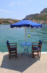 Table and chairs by The Sea in Kastellorizo,Greece