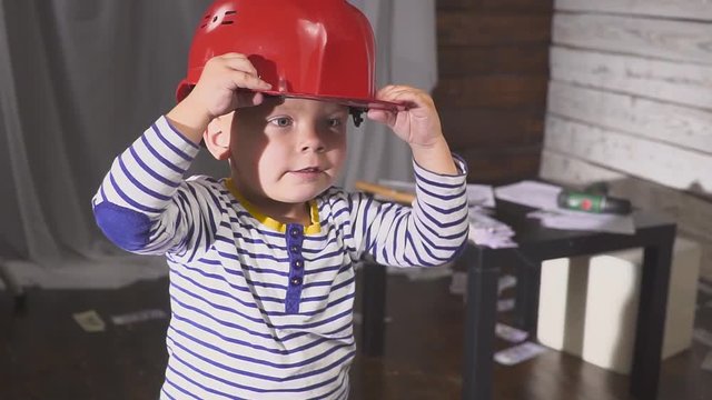 portrait boy builder in helmet smiling