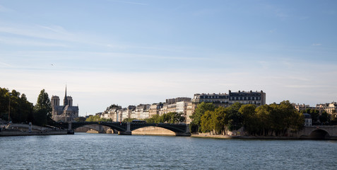 PARIS, FRANCE, SEPTEMBER 8, 2018 - Isle de la Cite with Notre Dame Church seen from the boat from Seine River of Paris, France.