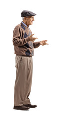 Senior man standing alone and gesticulating conversation