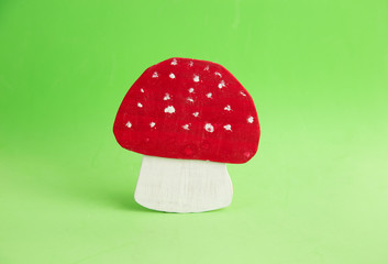 wooden props mushroom on colorful background