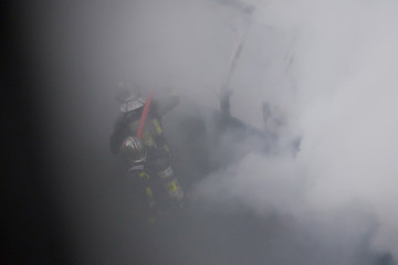 Fototapeta na wymiar Firemen in Smoke