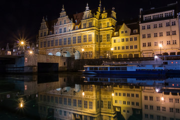 Fototapeta na wymiar Ancient houses on the promenade of Gdansk at night. Poland