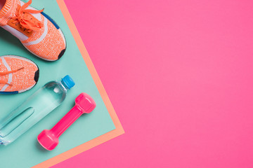 Flat lay with sport equipment on pink background - obrazy, fototapety, plakaty