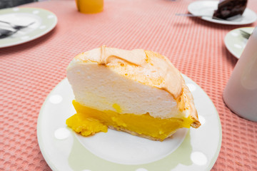 Lemon meringue pie on white plate