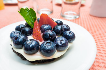 piece of blueberry cheesecake on white plate
