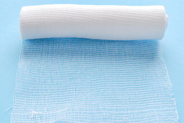 Medical sterilized bandage on blue.