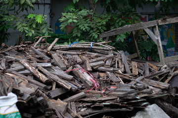 Pile of Sliver, lumber, scantling near the house