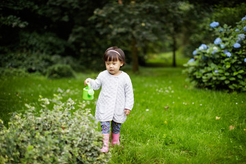 toddler baby girl play  ferrule toy ringer circles in Spring forest park