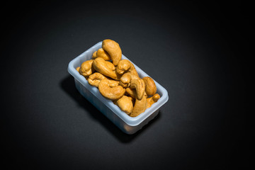 Cashews In white plastic box
