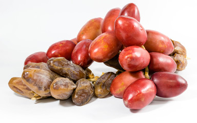 A bunch of fresh red date fruits and A bunch of dried red date palm