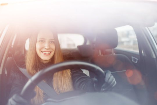 Young Lady Driving A Car In Winter