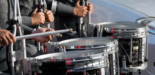 the drummer playing snare drum in parade
