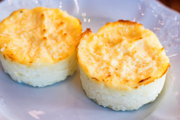 Tasty mozzarella pudding on white plate close