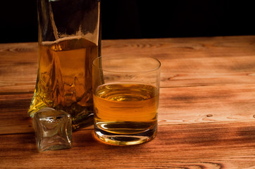 Glasses for whiskey on a wooden table