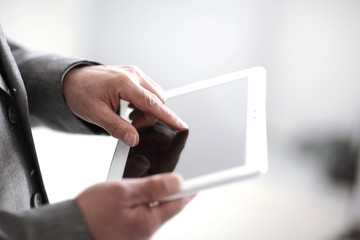 close up.businessman presses on the screen of a digital tablet.p