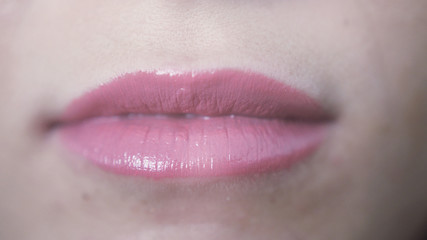 Fototapeta premium Close up beautiful pink lips of young girl